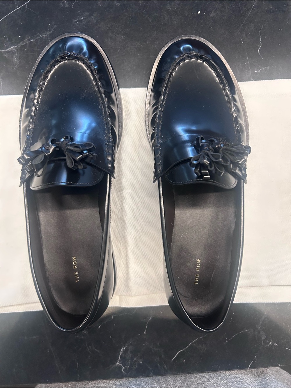 The Row Black Leather Tassel Loafers